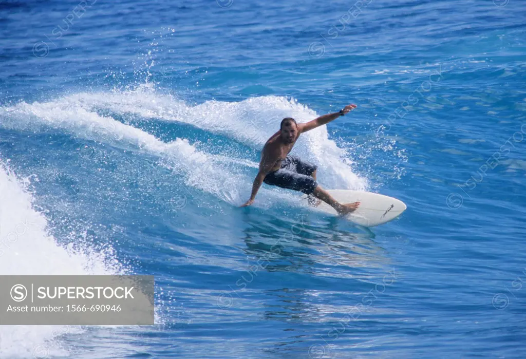 Surfer on wave, Pointe des aigrettes, Saint Gilles les Bains , La Reunion island (France), Indian Ocean