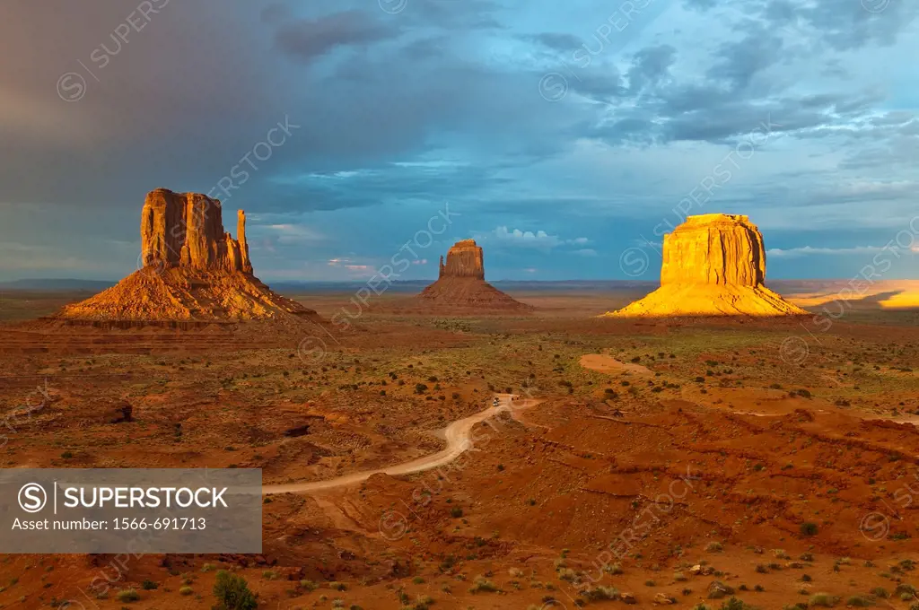 The Mitten Buttes in the last light during a storm, Monument Valley, Arizona, USA.