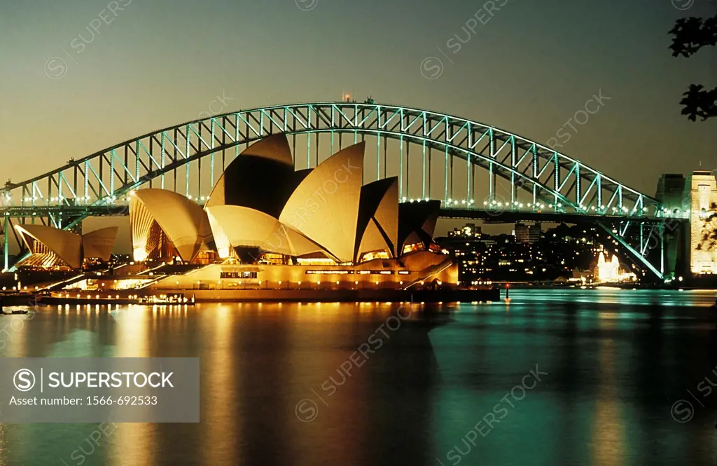 Sydney Opera House and Harbour Bridge at night.