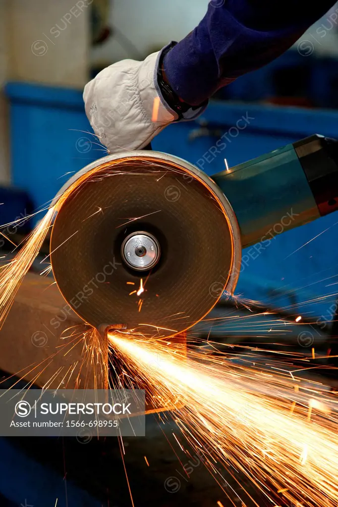 Cutting square hollow steel section, grinding machine with abrasive wheel, metallurgy, Legazpi, Gipuzkoa, Euskadi, Spain