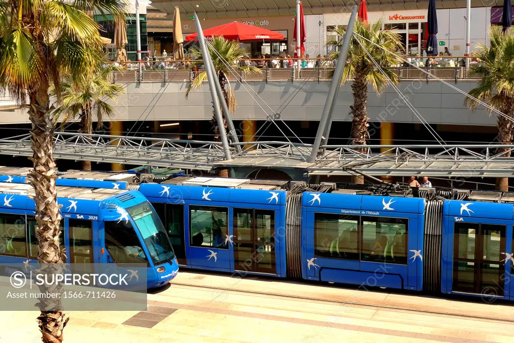 A new electric tram arrives at the tram station within the Odysseum shopping center in Montpellier, France