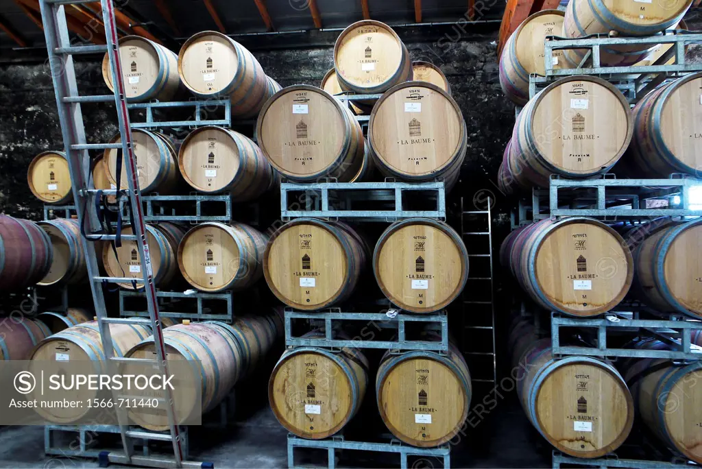 Barrels full of aging wine in a modern winery