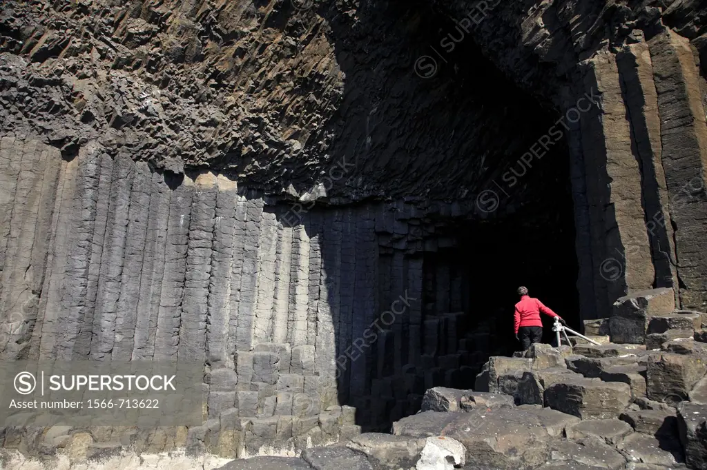 Tourist at entrance to Fingal´s Cave, Staffa, Scotland, United Kingdom