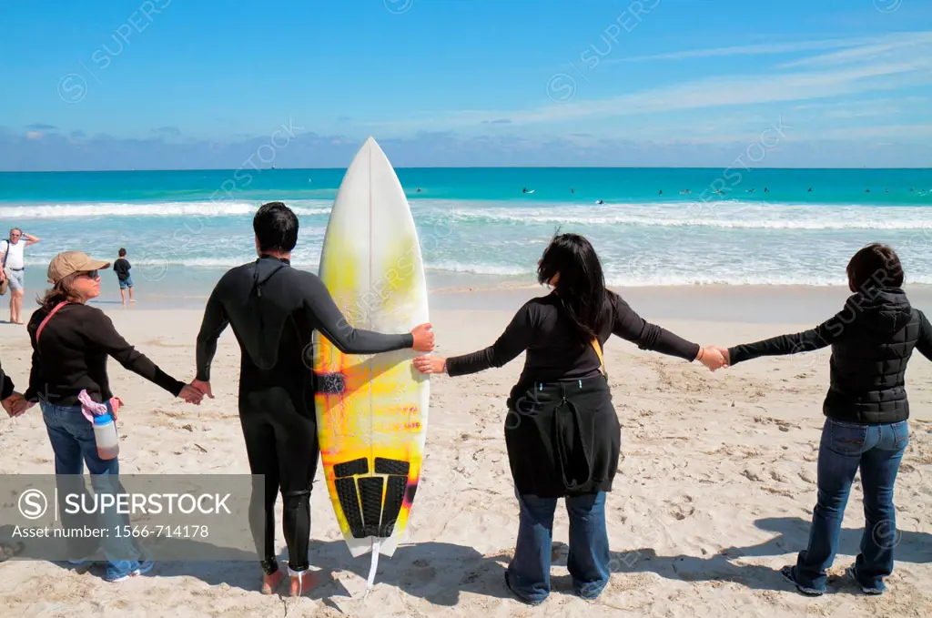 Florida, Miami Beach, Surfrider Foundation, No Offshore Florida Oil Drilling Protest, black clothing represents oil, hold hands, Atlantic Ocean, surf,