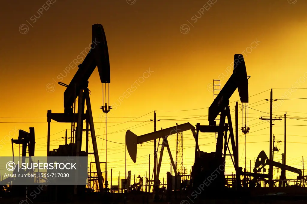 Oil Pumps at work in oil and gas field USA
