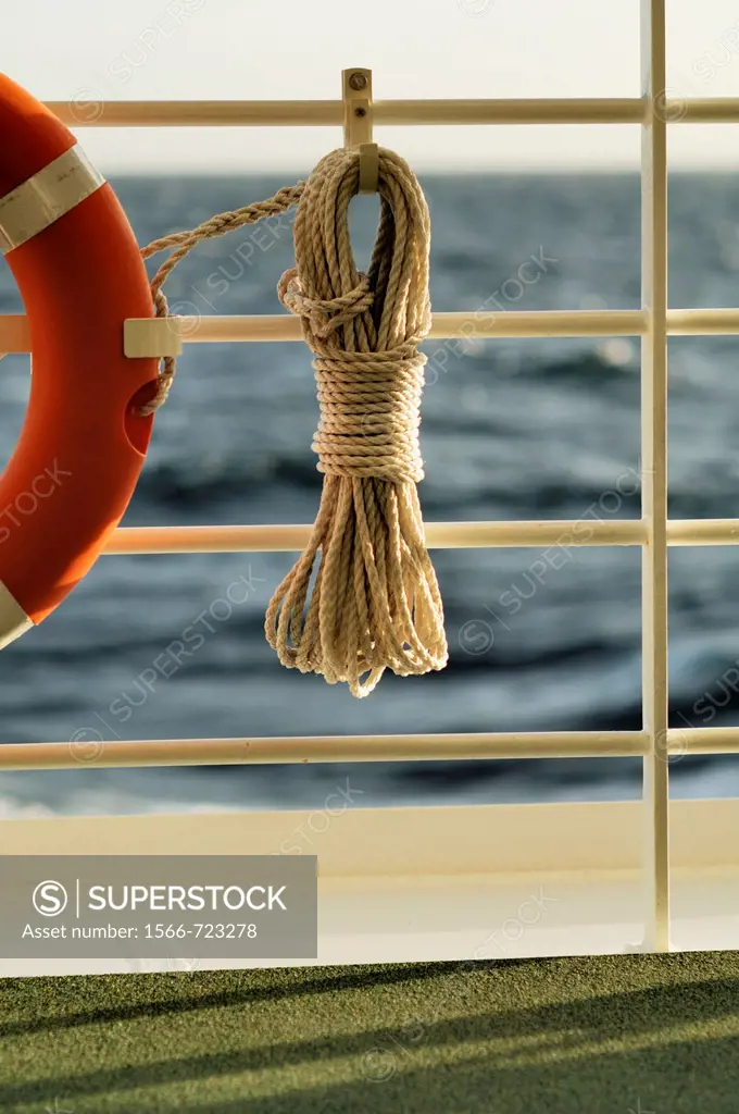 Life ring with rope and the Mediterranean in the background