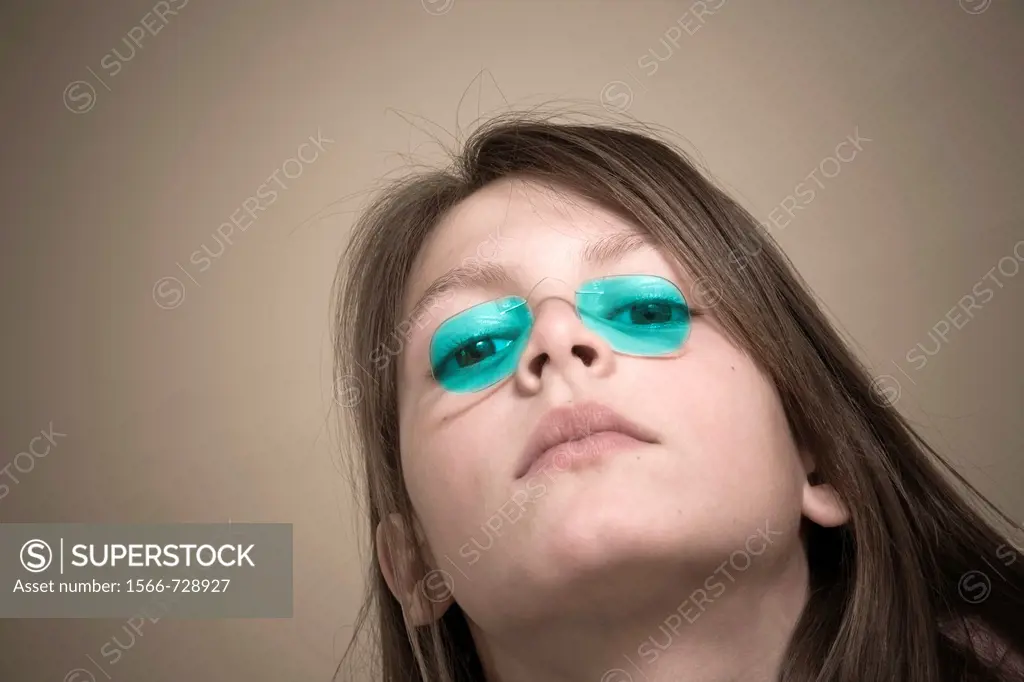 Preteen girl wearing old-fashioned glasses