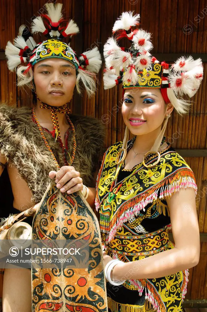 portrait of a traditional Orang Ulu warrior and Kenyah woman in Sarawak, Borneo, Malaysia