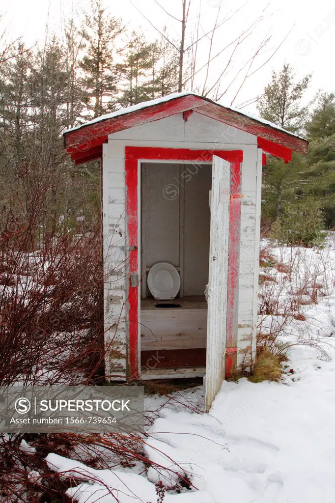 an outhouse or outdoor toilet used in North America in rural areas