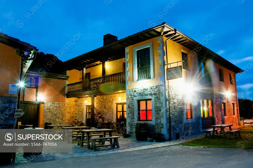 Facade of La Peña´l Cura restaurant, night view. Porrúa, Asturias province, Spain.
