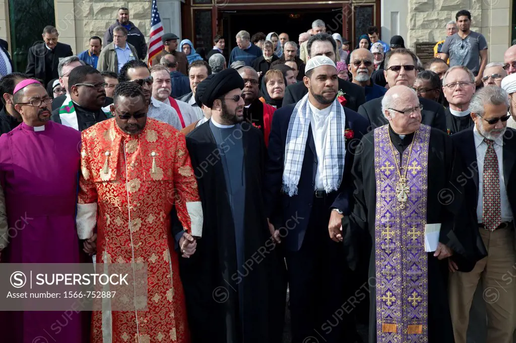 Dearborn, Michigan - Religious leaders from Muslim, Christian, and Jewish faiths led a prayer service and vigil at the Islamic Center of America in op...