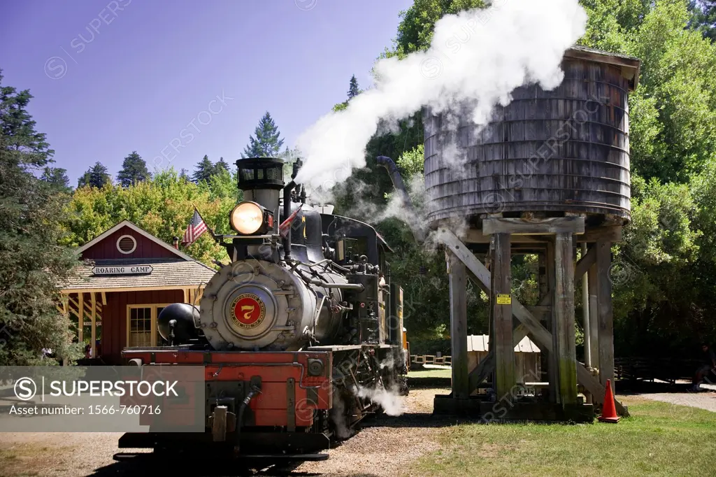 A steam train arrives at Roaring Camp depot