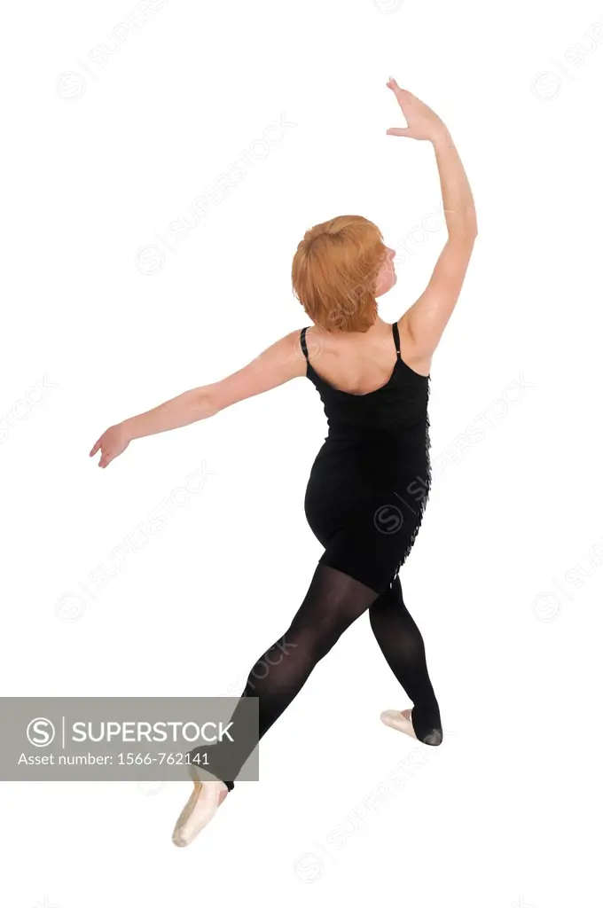 Female Ballet Dancer balances on her tows On white Background