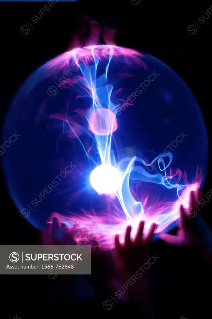 Children´s hands on a Plasma Globe