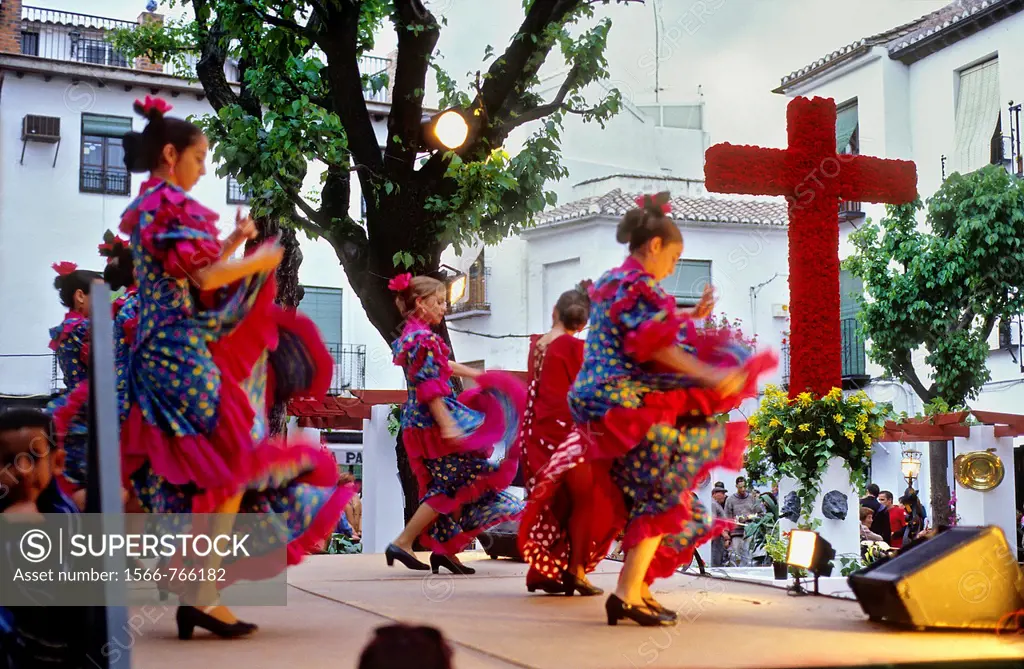 Dia de la Cruz, floral cross and dancers, in Plaza Larga,Albaicin quarter, Granada, Andalucia, Spain