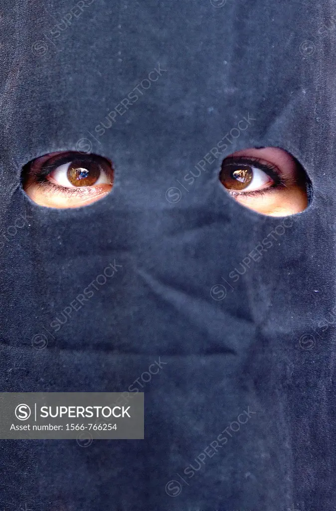 Eyes of a peniente Holy Week procession `La Sed´ Holy Wednesday  Seville  Spain