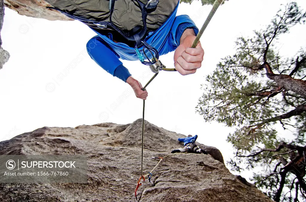 Rock climbing a route called Broke Back which is rated 5,11 and located on the True Grit formation at Castle Rocks State Park near the town of Almo in...