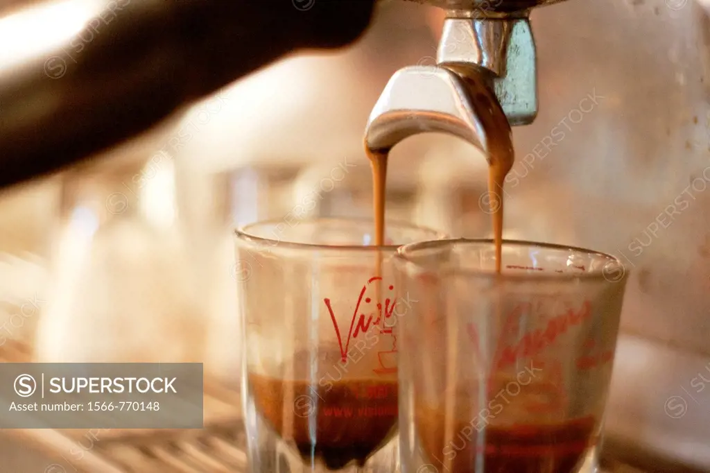 A pair of espresso shots being poured