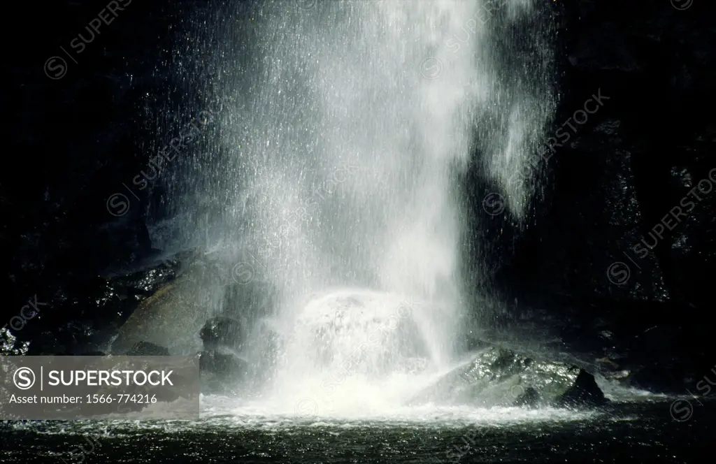 waterfall cascade on black rocks