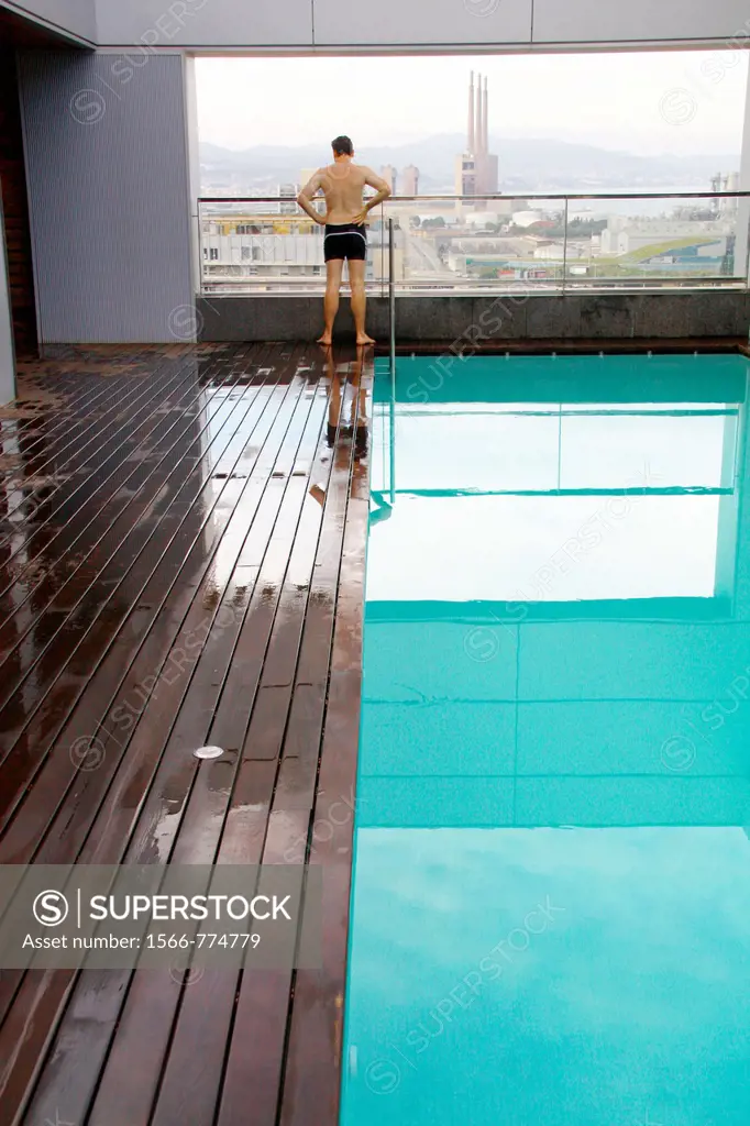 View of buildings in San Adria de Besos from the pool floor in a hotel, Barcelona, Catalonia, Spain