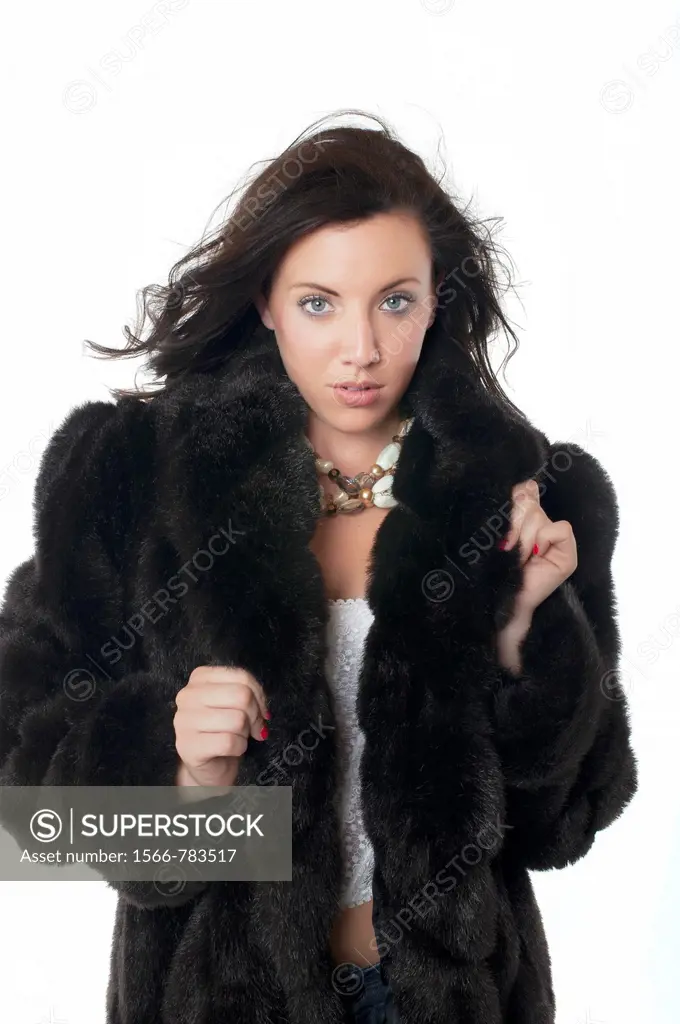 Sexy woman wearing fur coat