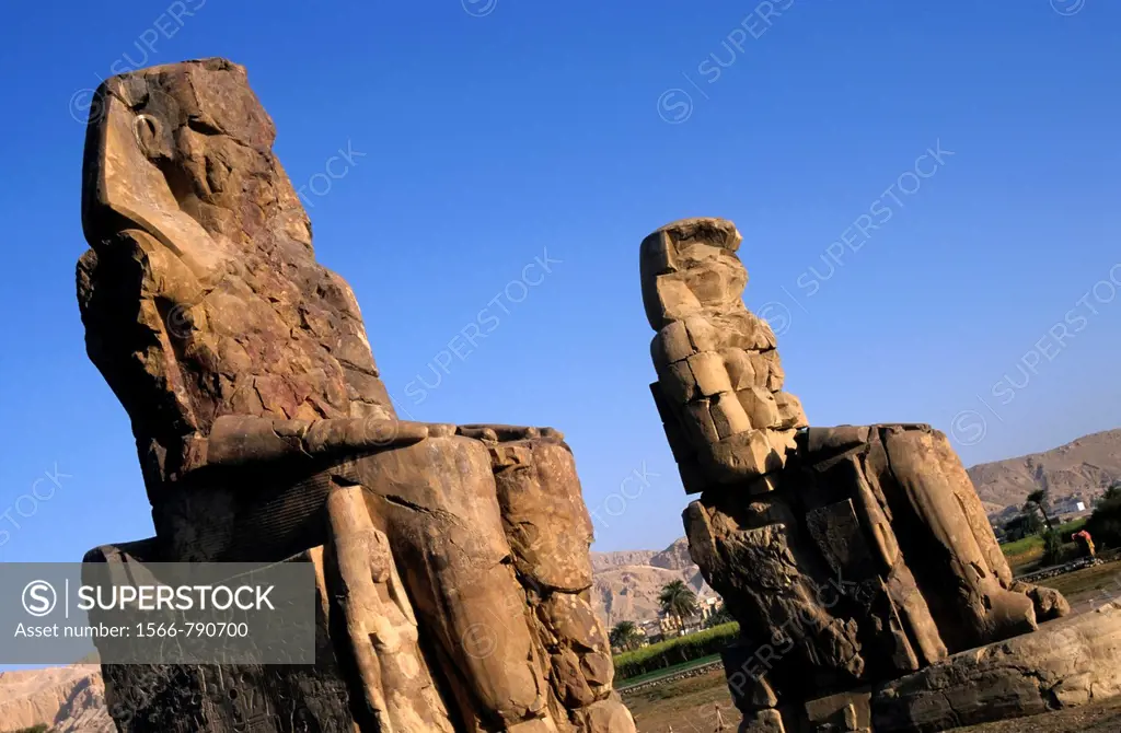 The Colossi of Memnon, two massive stone statues of Pharaoh Amenhotep III, in the Theban necropolis, Luxor, Egypt