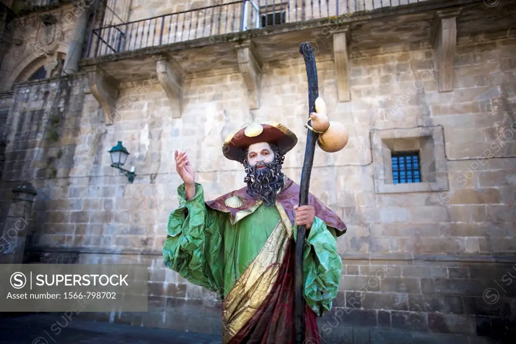 A mime dressed as St James the Apostle stands in the Obradoiro square of Santiago de Compostela, Spain. Hundred of thousands pilgrims walk every year ...
