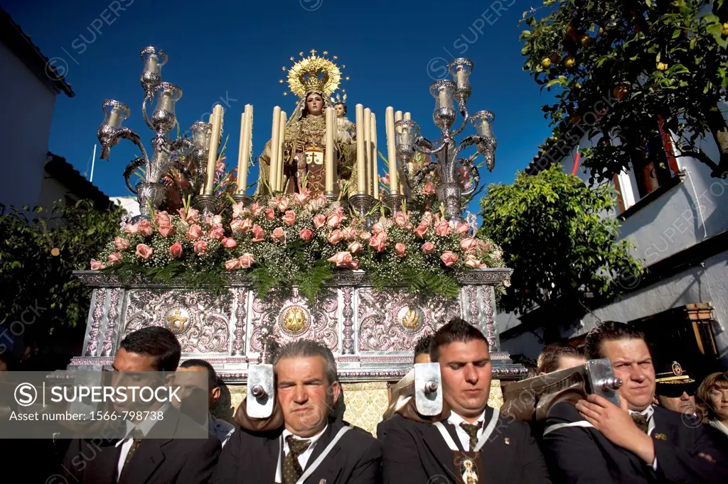 Bearers of religious images carry a Virgin of Carmen sculpture during an Easter procession in the town of Prado del Rey in southern Spain´s Cadiz Sier...