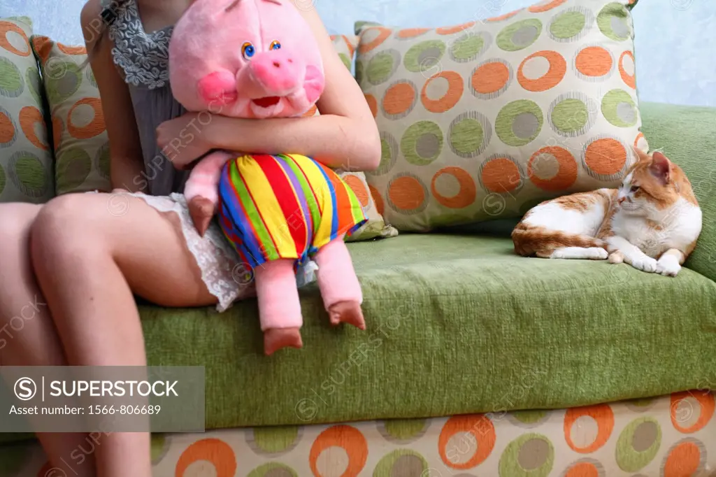 Beautiful Blond girl with her Plush Pig