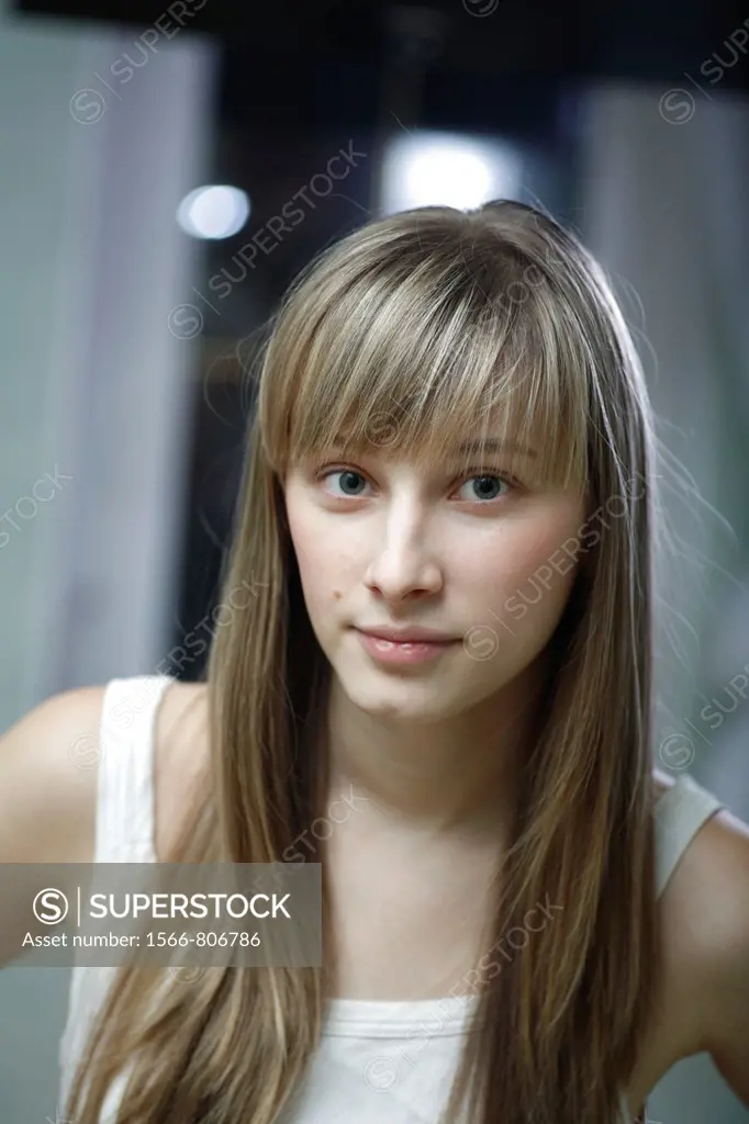 headshot of the pretty blond women weared tank top indoors front view Caucasian, 24 years old