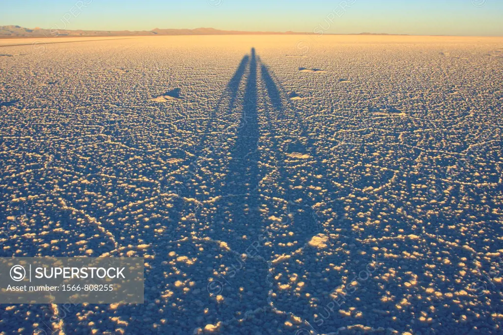 Shadow of a biker on the frozen salt lake called ´Salar de Uyuni´ in Bolivia