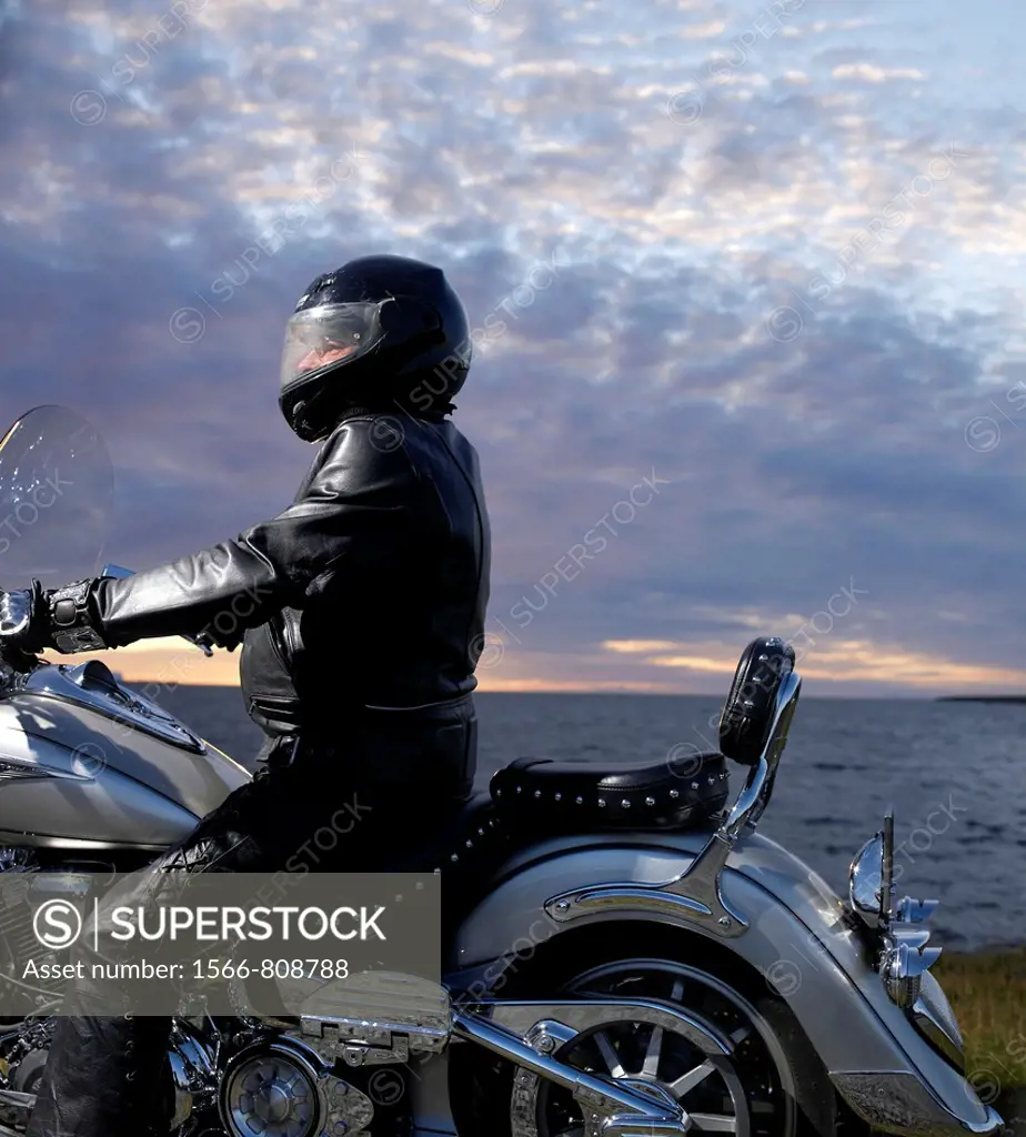 Motorcyle rider by the sea, Reykjavik, Iceland