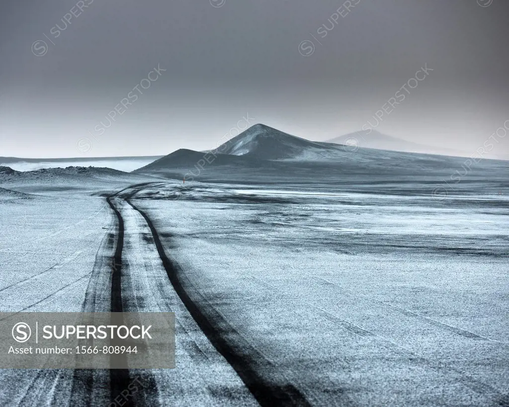 Light snow on ash filled landscape wth jeep tracks off road  Iceland  Asf fall from the Grimsvotn, volcano eruption which began on May 21, 2011