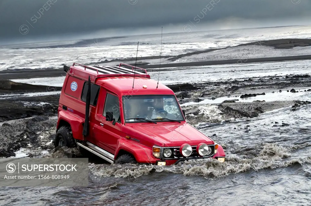 Big Red crossing the Tungnaa glacial river filled with ash from the Grimsvotn volcanic eruption, Iceland  Eruption began on May 21, 2011 spewing tons ...