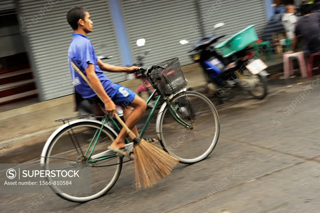 man riding his bicycle , Street life , Living in mae sot , thai Burmese border town , northern thailand
