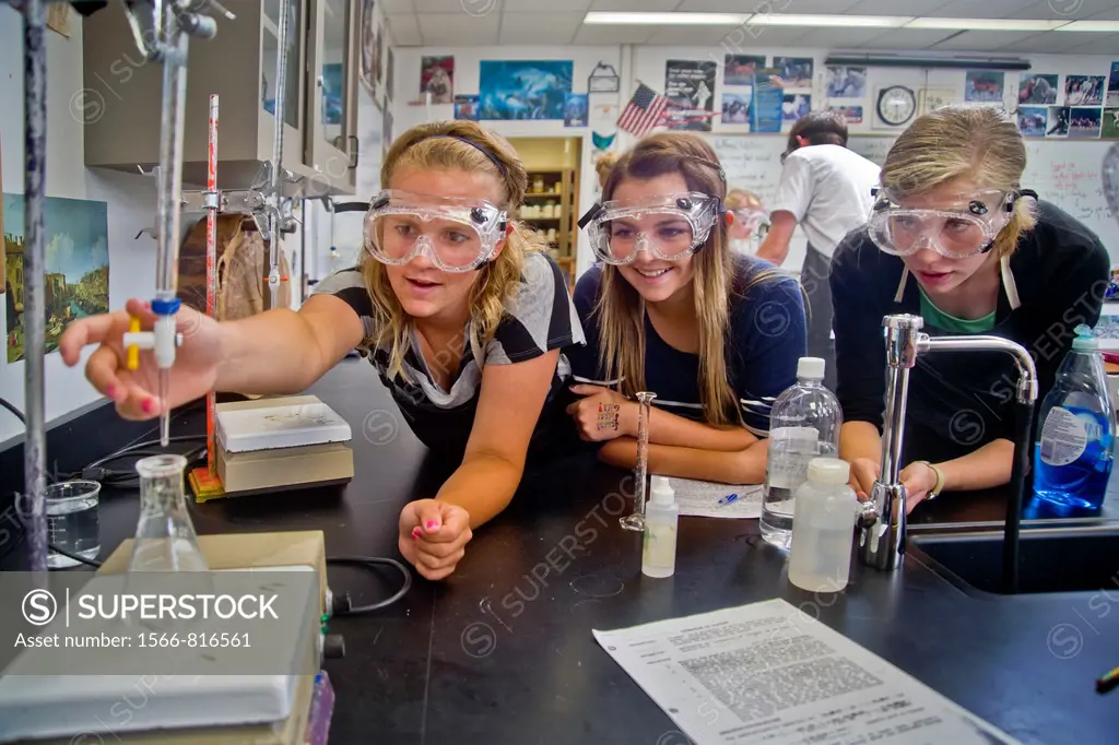 High school chemistry students in San Clemente, CA, perform an experiment using titration, a method of quantitative chemical analysis  A reagent of a ...