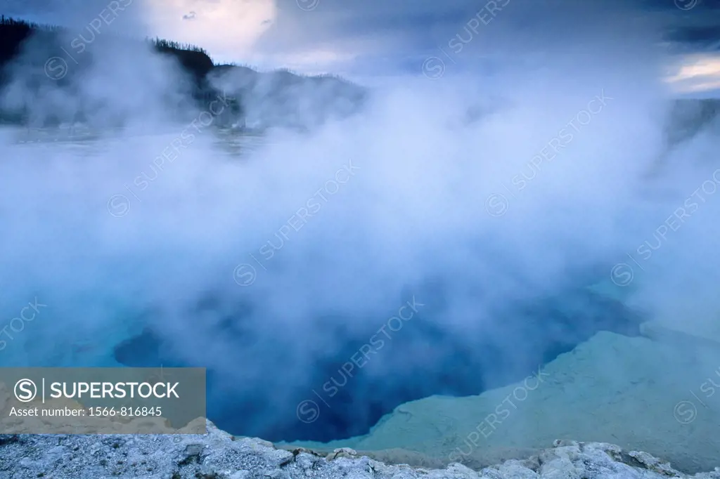 Steam rising off Sapphire Pool on a stormy evening, Biscuit Basin, Yellowstone National Park, WYOMING