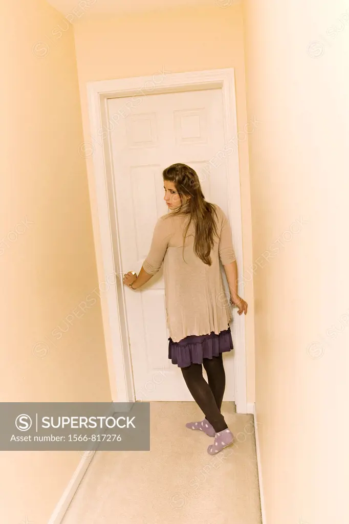 Teen girl in the hallway of her house