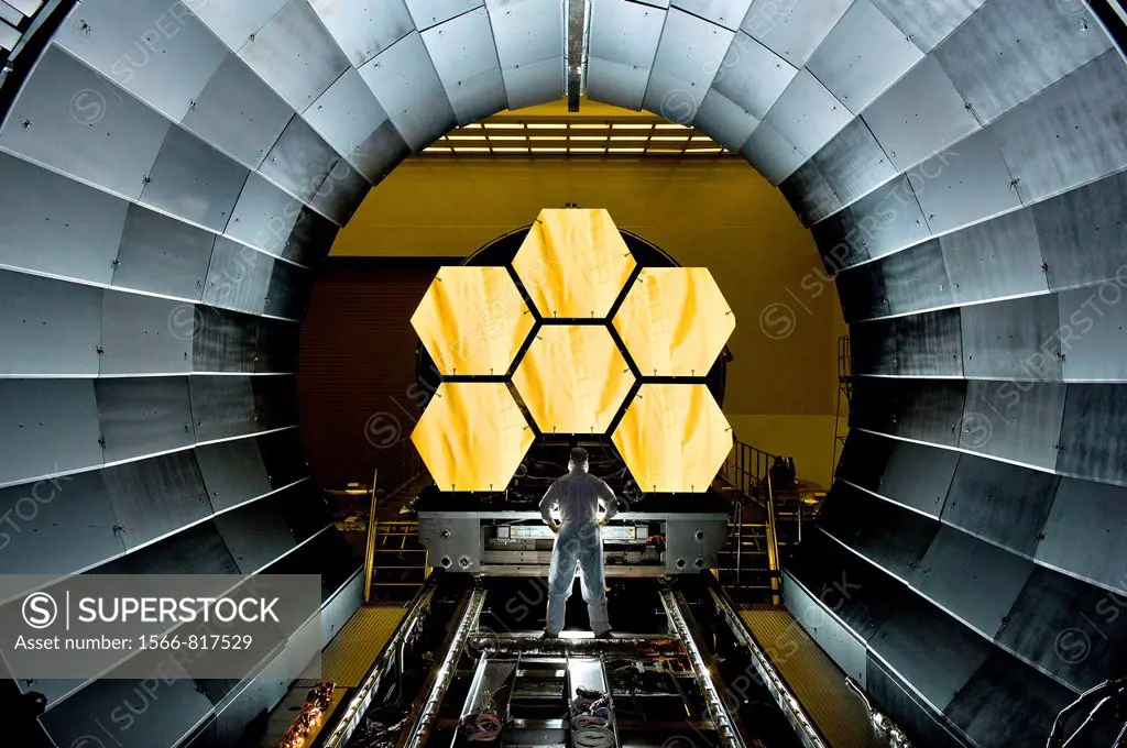Next Generation Space Telescope  NASA engineer Ernie Wright looks on as the first six flight ready James Webb Space Telescope´s primary mirror segment...