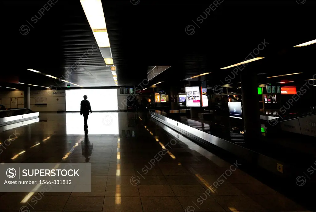 one man walking, Warsaw Chopin airport, Poland