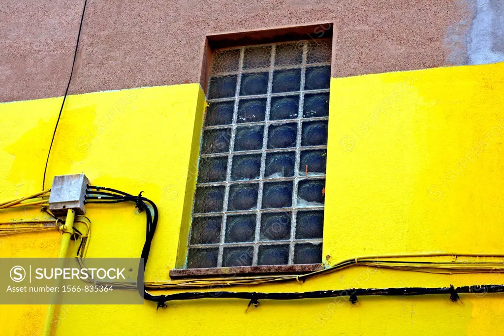 window, yellow wall, Sabadell, Catalonia, Spain.
