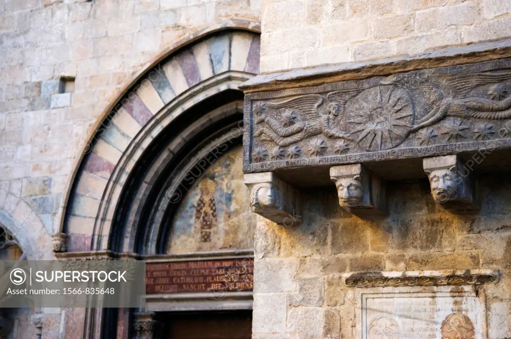 Sarcophagus and polychrome tympanum of the South gate, detail of the Collegiate church of Sant Feliu, Girona, Catalonia, Spain