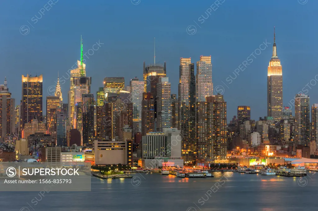 The skyline of Manhattan, New York City, USA at twilight as viewed over the Hudson River from New Jersey