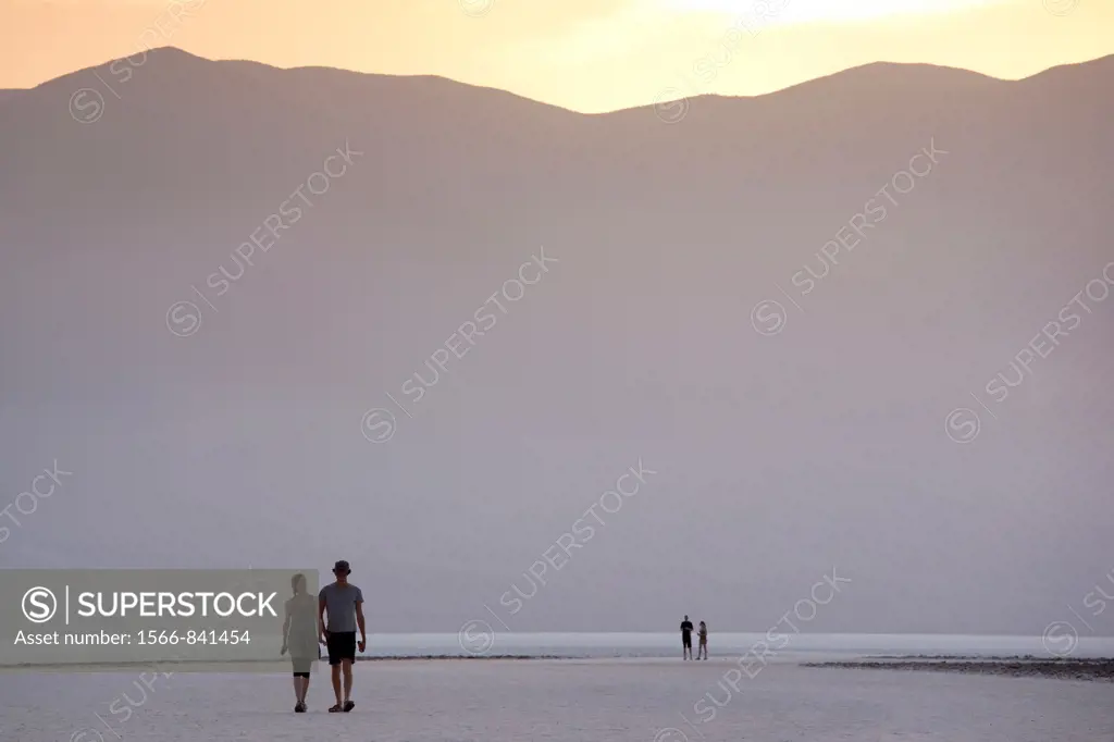 USA, California, Death Valley National Park, Badwater, elevation 282 feet below sea level, lowest point in the Western Hemisphere, sunset view with vi...