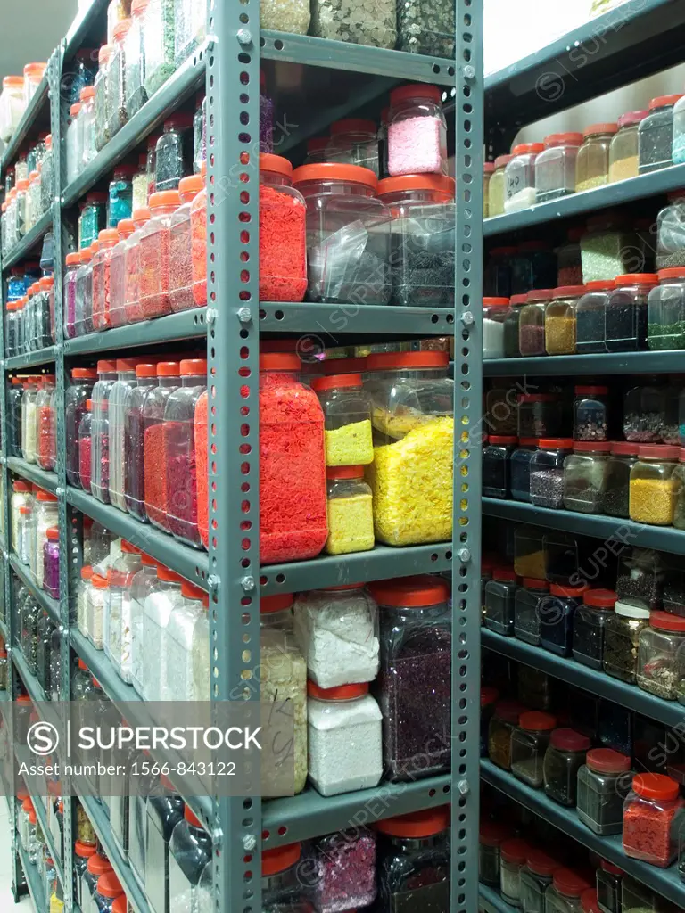 Shelves of jars of beads, sequins and various embellishments in the Mumbai, India workshop/office of an Indian company that makes embroidery for the f...