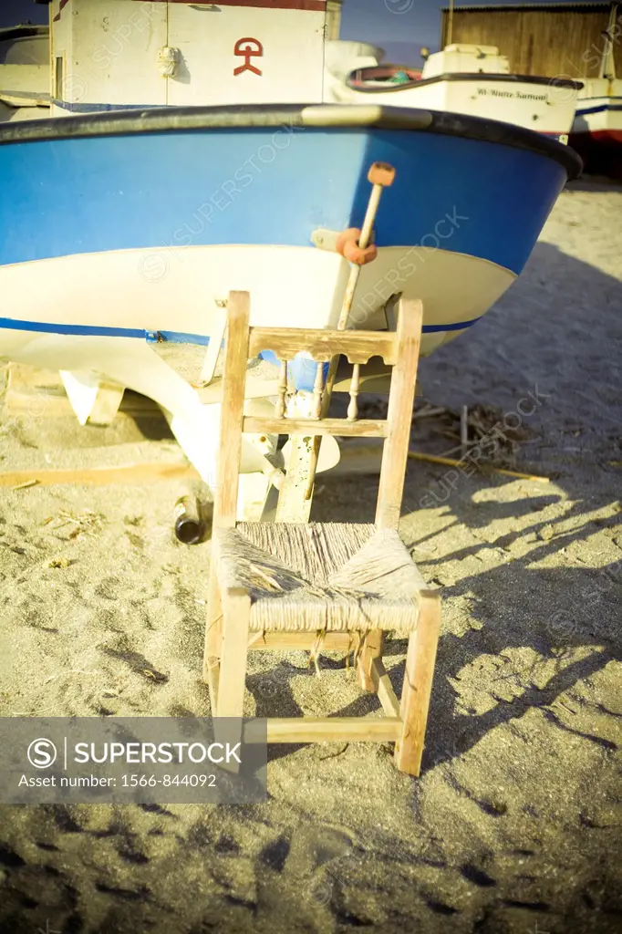 Chair and boat, Cabo de Gata, Almeria, Spain