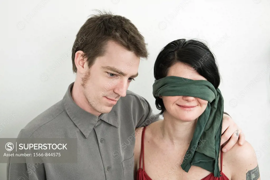 Husband and his blindfolded wife