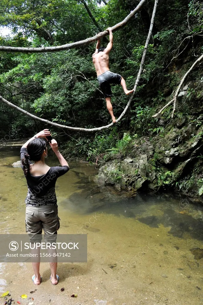 Okinawa (Japan): friends playing by the Ta waterfall
