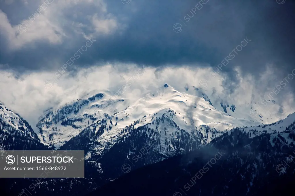  Snow storm moving in on the snow capped Olympic Mountains in the U.S.
