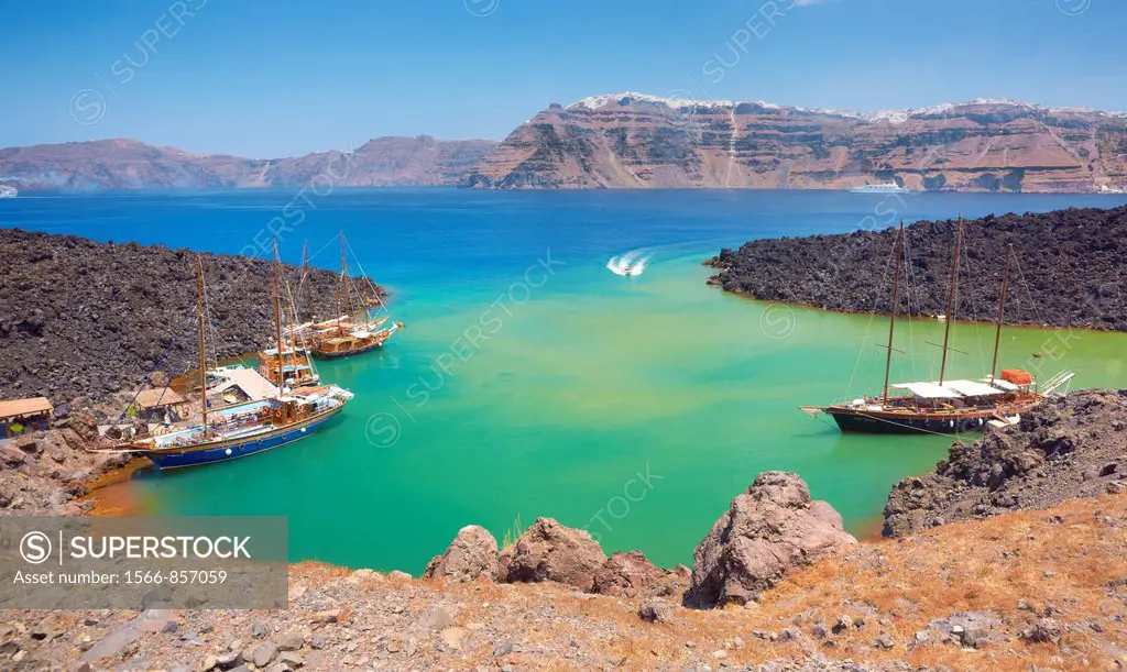 Excursion boats at the harbour of Nea Kameni Island, Santorini, Cyclades, Greece